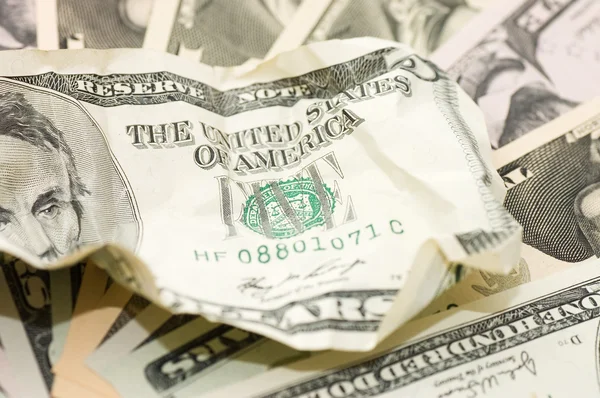The crumpled banknote on new dollars — Stock Photo, Image