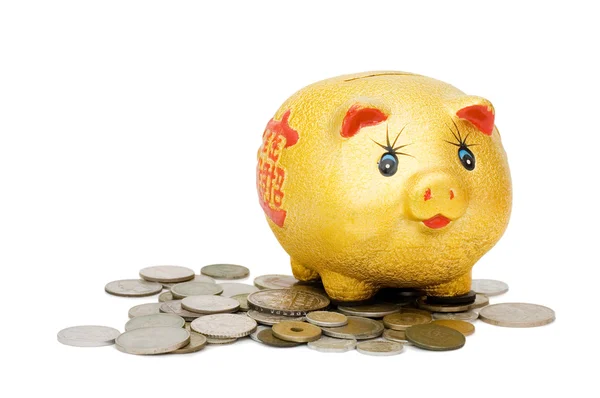 Monedas viejas y un cerdo una caja de monedas — Foto de Stock