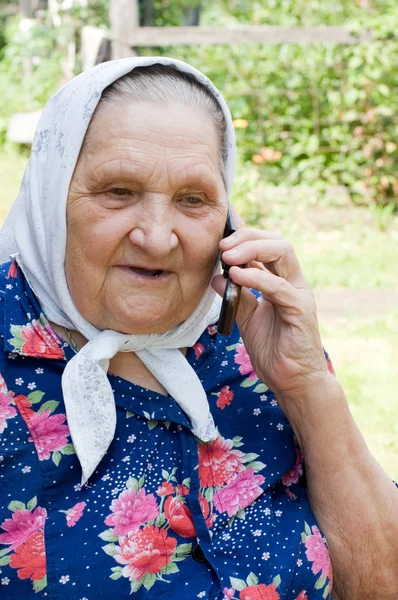 Grandmother talking with a phone — Stock Photo, Image