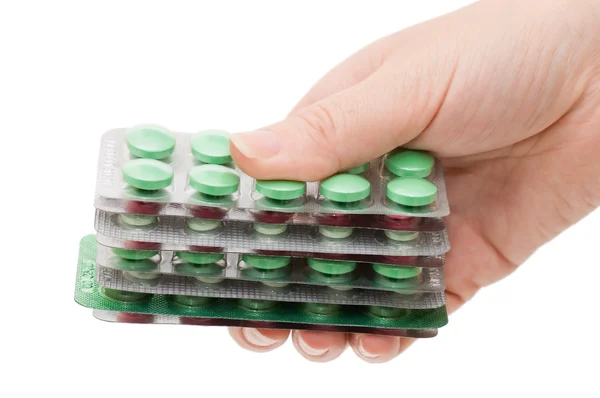 Mani piene di pastiglie isolate su sfondo bianco — Foto Stock