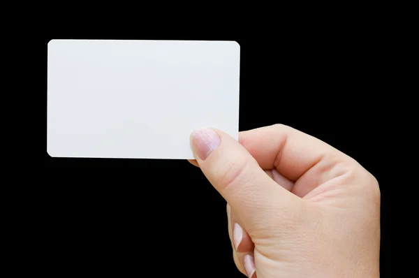 Papierkarte in Frauenhand isoliert auf schwarzem Hintergrund — Stockfoto