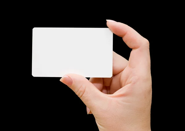 Cartão de papel na mão da mulher isolado no fundo preto — Fotografia de Stock