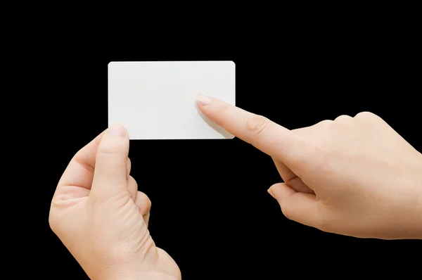 Papperskort i kvinna hand på svart bakgrund — Stockfoto