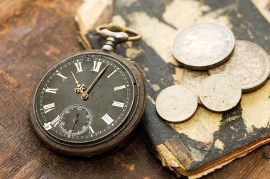 The old book, old watch and money clipart