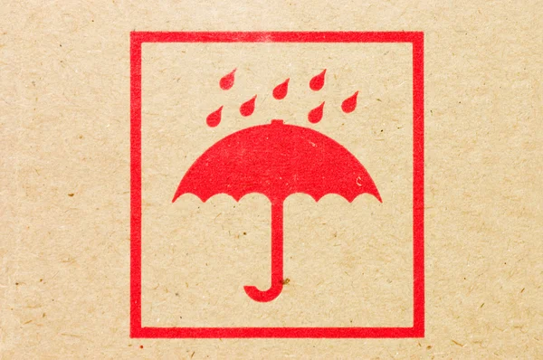 stock image Sign an umbrella on a box