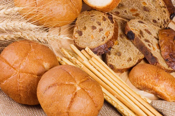 Fresh bread with ear of wheat — Stock Photo, Image
