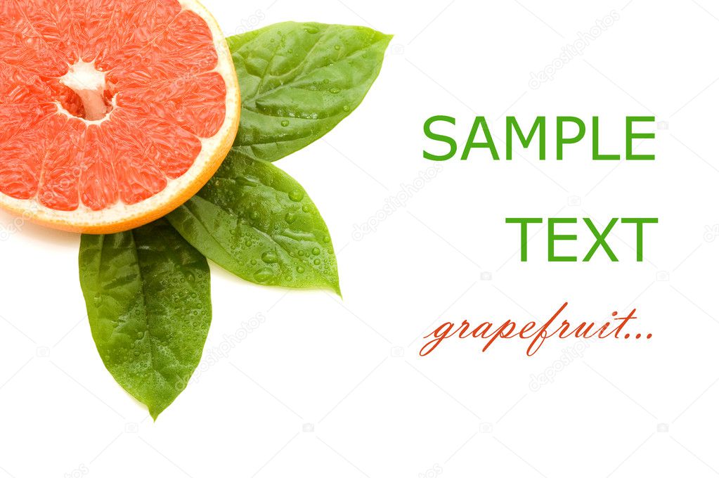 Fresh juicy grapefruits with green leafs. Isolated