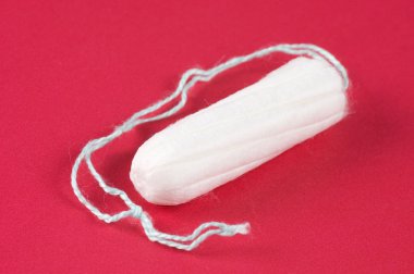 Ladies feminine hygiene product on a red background clipart