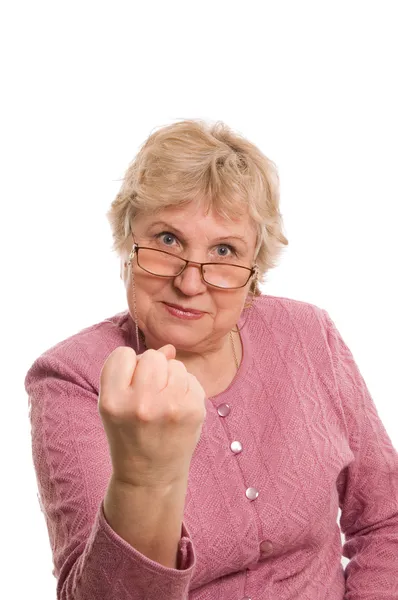 De oudere vrouw toont een vuist — Stockfoto