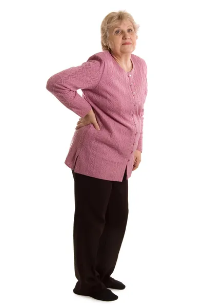 A mulher idosa com uma dor em umas costas — Fotografia de Stock