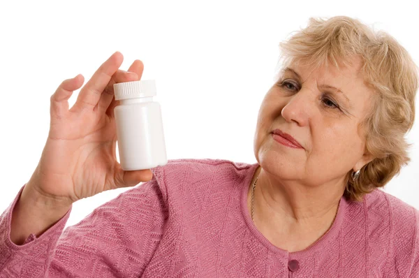 De oudere vrouw met tabletten — Stockfoto