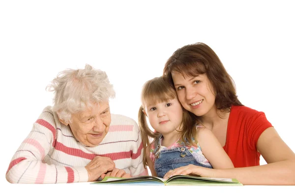The grandmother with the grand daughter read the book — Stock Photo, Image
