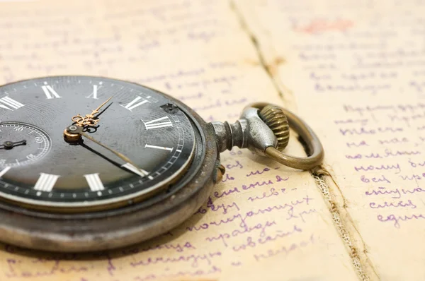 Watch on an old notebook with the text — Stock Photo, Image