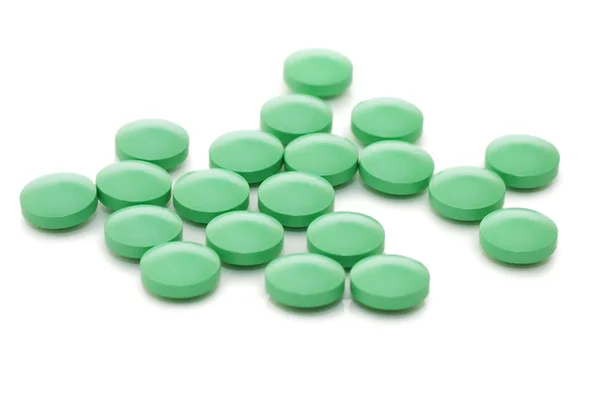 Montón de pastillas aisladas sobre fondo blanco —  Fotos de Stock
