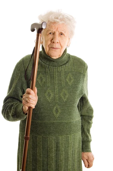 Бабушка держит трость на белом фоне — стоковое фото