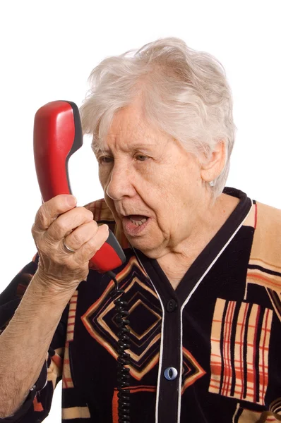 De oudere vrouw spreekt op de telefoon — Stockfoto