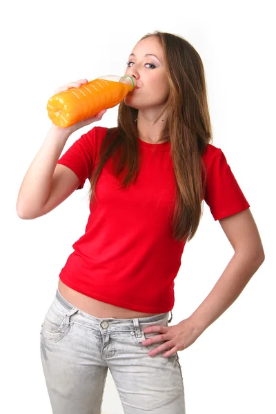 A sportos lány narancslevet inni — Stock Fotó