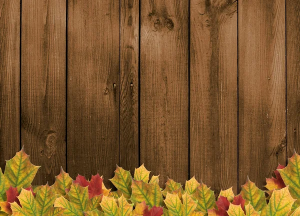 Karta na wakacje z liści jesienią na drewniane backgrou — Zdjęcie stockowe
