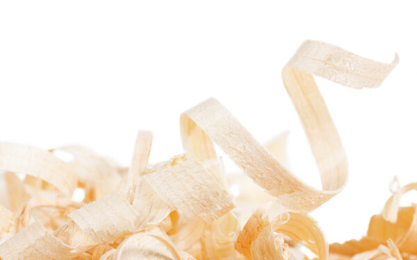 Macro view of heap of wooden spiral shavings.