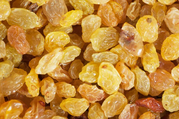 Golden yellow raisins background — Stock Photo, Image