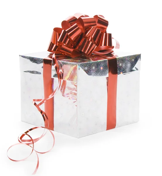 Silver gift with red ribbon isolated over white — Stock Photo, Image
