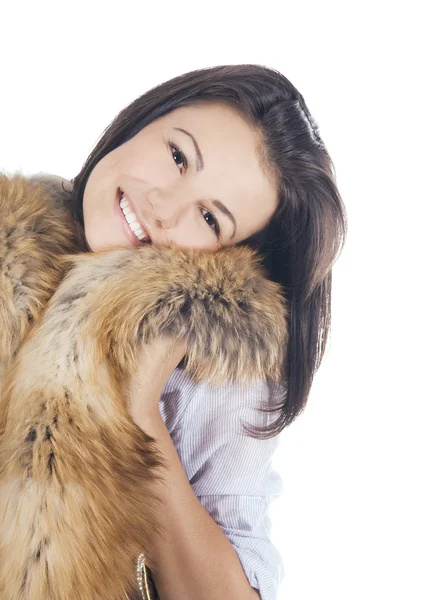 Beautiful young woman posing with a fur — Stock Photo, Image