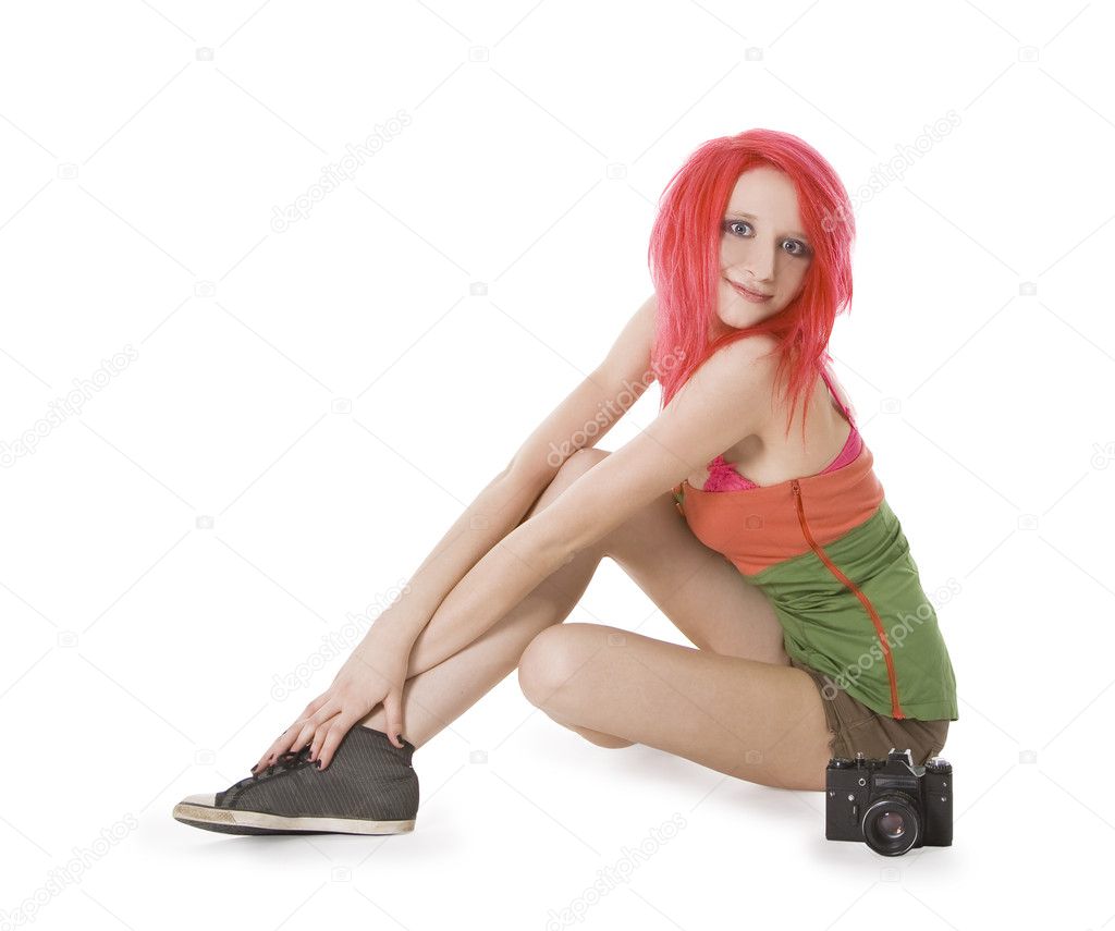 Red-hair girl posing with photocamera