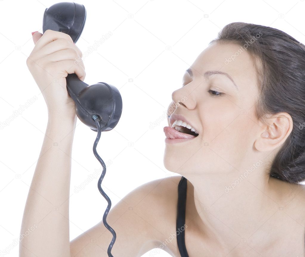 Bright picture of fun brunette showing tongue to phone