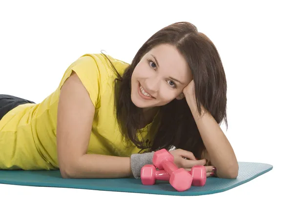 Attractive young female with fitness dumbbells in sport center — Stock Photo, Image
