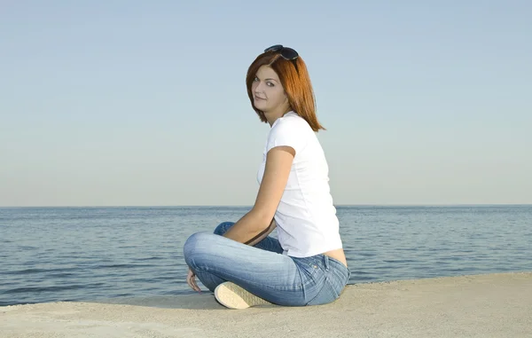 stock image Young female looking to the ocean