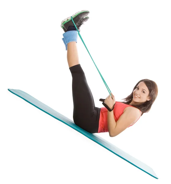 stock image Attractive young female with fitness expander in stretching