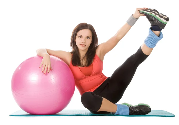 Attractive young female with fitness ball in sport center — Stock Photo, Image