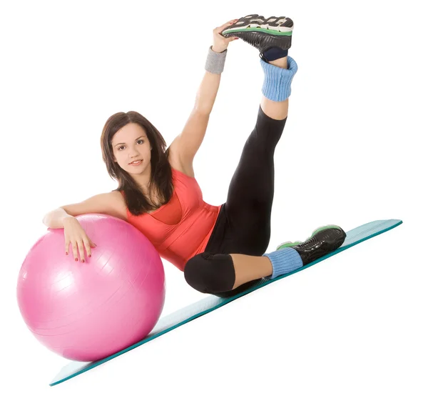 Attractive young female with fitness ball in sport center — Stock Photo, Image
