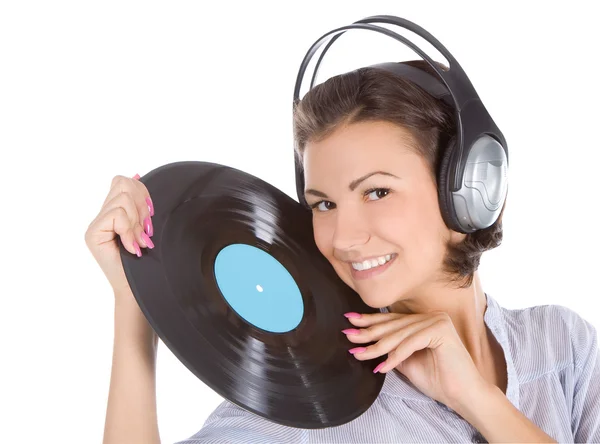 Emotional brunette in headphone with vinyl record over white — Stok Foto