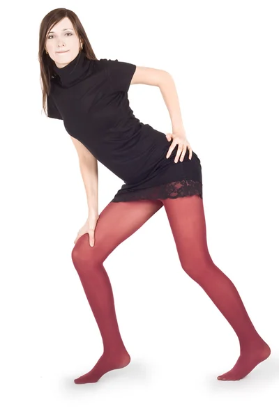 Mulher encantadora em meias vermelhas posando sobre fundo branco — Fotografia de Stock