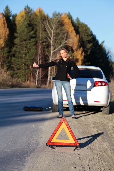 Woman trying to catch someone who may help her — Stock Photo, Image
