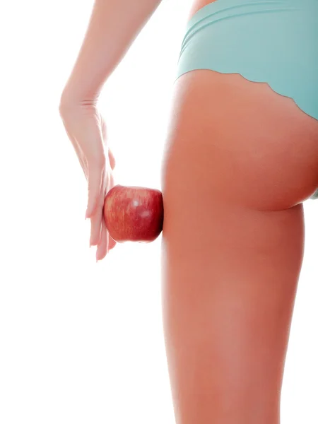 Figura femenina perfecta y manzana roja — Foto de Stock