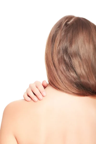 Женщина массирует боль в спине — стоковое фото