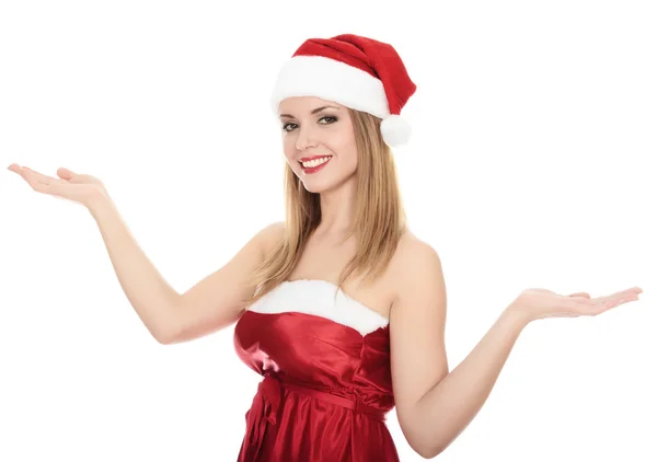 Hübsches Mädchen mit rotem Weihnachtsmütze, das eine Handfläche in die Höhe hält. — Stockfoto