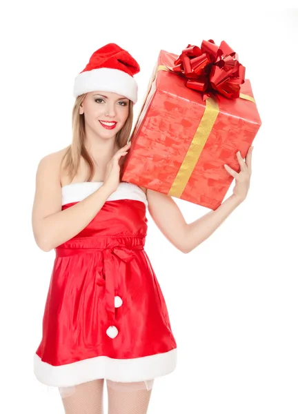Allegro Babbo Natale aiutante ragazza con grande confezione regalo sulla spalla — Foto Stock