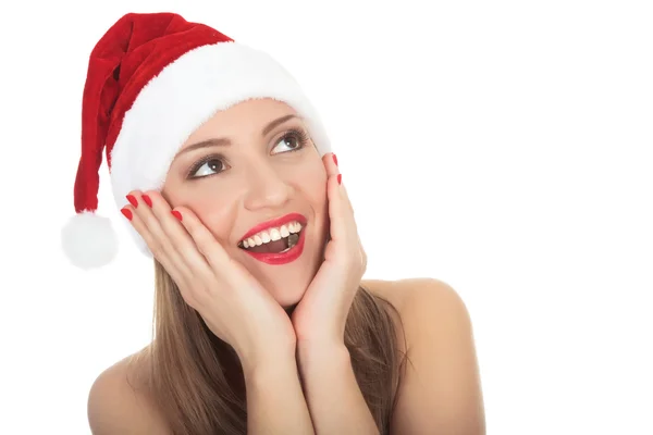 Überrascht schöne junge Frau mit Weihnachtsmütze. — Stockfoto