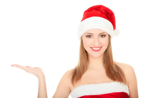 Pretty Christmas girl holding her hand palm up — Stock Photo, Image