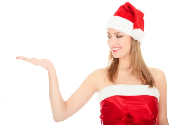Menina de Natal bonita segurando a mão palma para cima — Fotografia de Stock