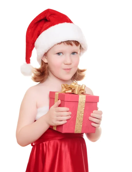 Meisje van de baby in KERSTMUTS houden haar kerstcadeau — Stockfoto