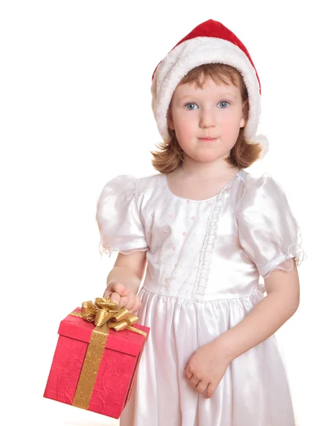 女婴在抱着她的圣诞礼物的圣诞老人的帽子 — 图库照片