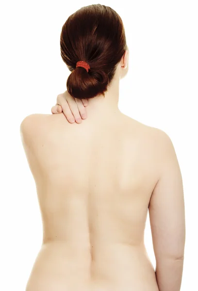 Frau massiert Schmerzen zurück isoliert auf weißem Hintergrund — Stockfoto