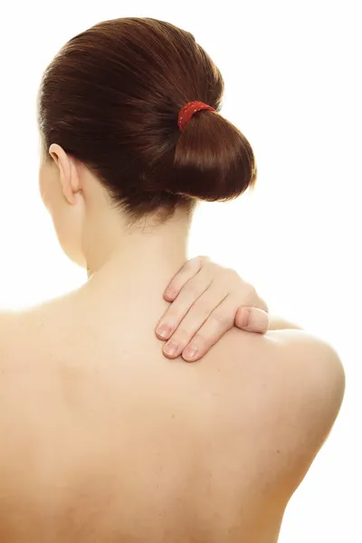 Frau massiert Schmerzen zurück isoliert auf weißem Hintergrund — Stockfoto