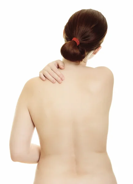 Mulher massageando dor de volta isolado sobre um fundo branco — Fotografia de Stock