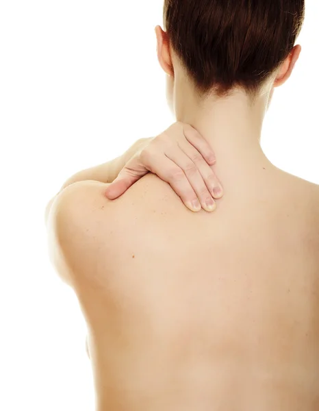 Mulher massageando dor de volta isolado sobre um fundo branco — Fotografia de Stock
