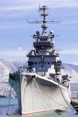 Battleship docked at a harbor clipart